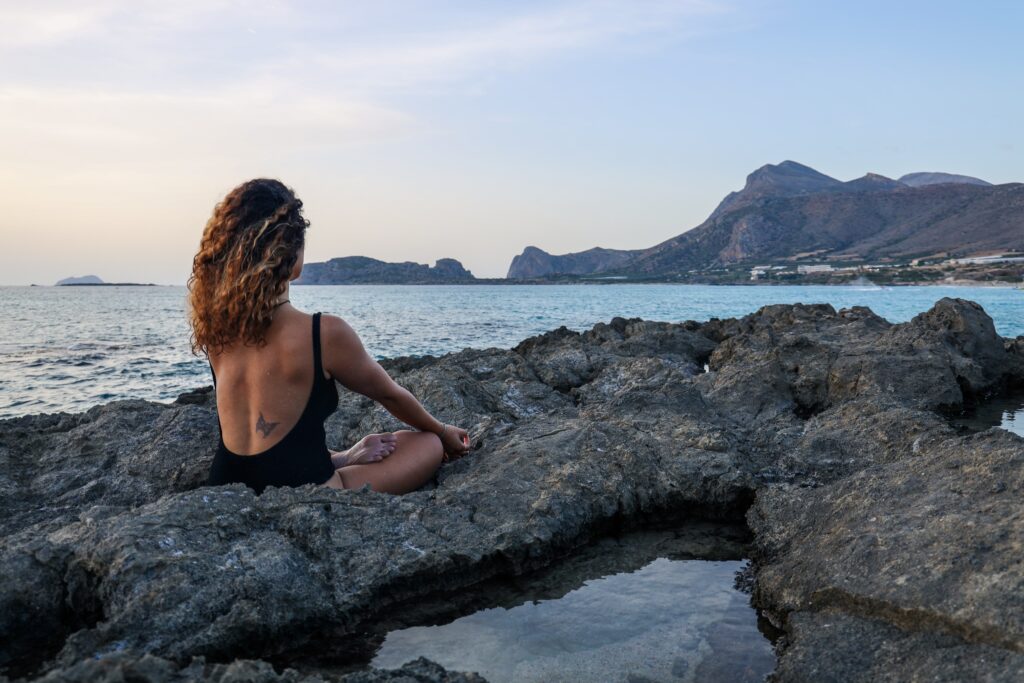 A photo of Moriah from Unrivaled Health contemplating the health benefits of magnesium complex supplements.